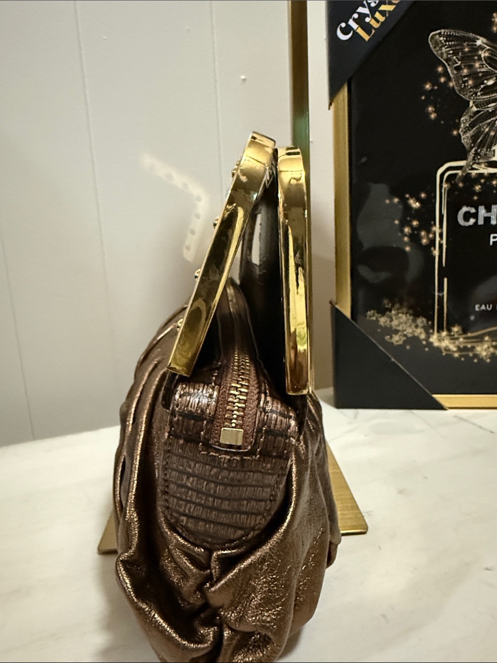 BCBGMAX Azria Bronze Metallic Pleated Wristlet Clutch with Gold Accents - Picture 9 of 11